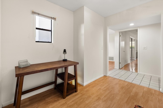 hall with light hardwood / wood-style floors