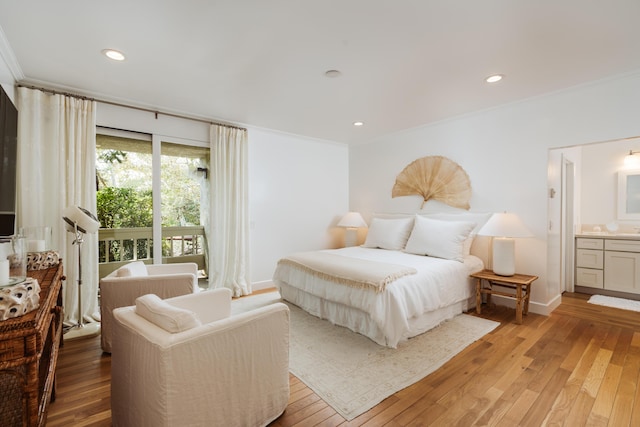 bedroom with ornamental molding, connected bathroom, hardwood / wood-style floors, and access to outside