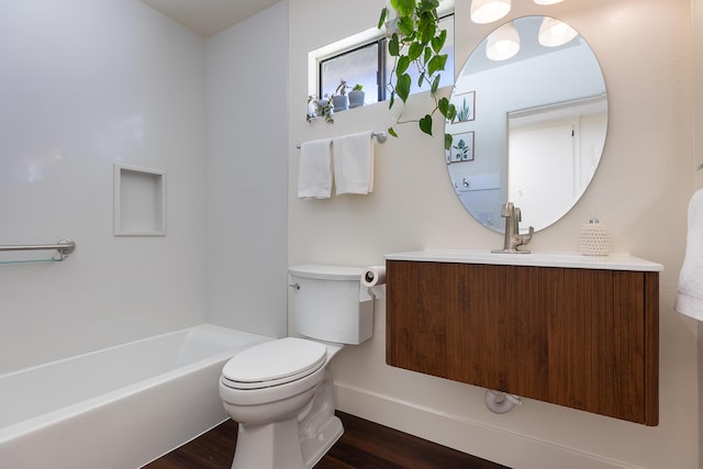 bathroom with toilet, a bathing tub, wood-type flooring, and vanity