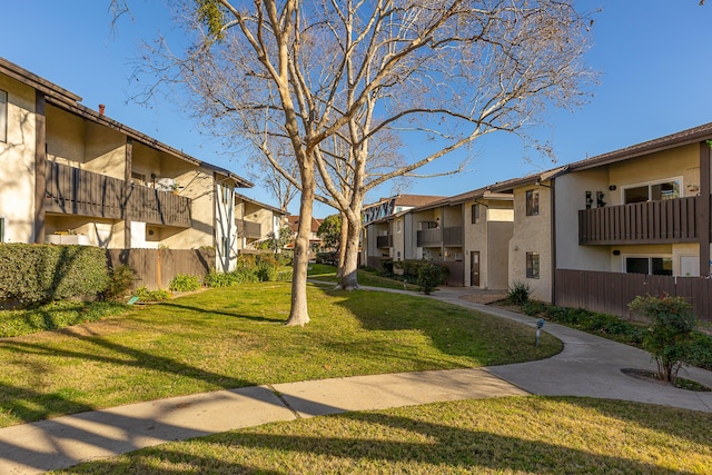 view of home's community featuring a lawn