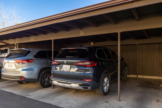 view of parking / parking lot with a carport