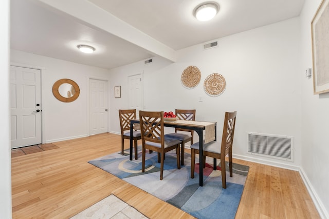 dining space featuring hardwood / wood-style flooring