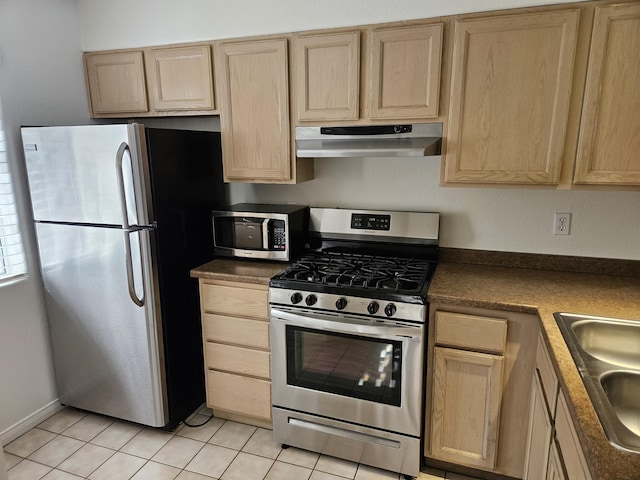 kitchen featuring light brown cabinets, exhaust hood, sink, light tile patterned floors, and stainless steel appliances