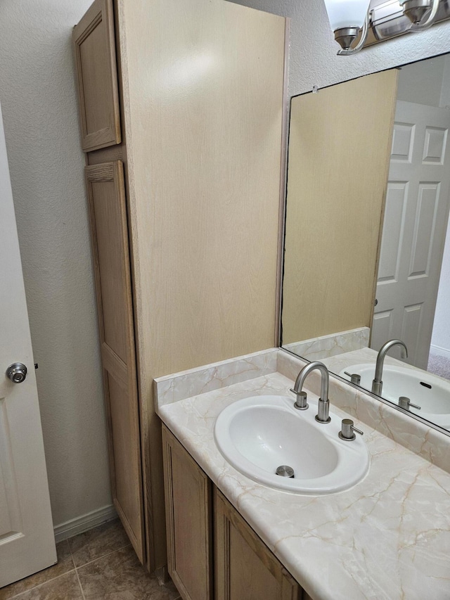 bathroom with vanity and tile patterned floors