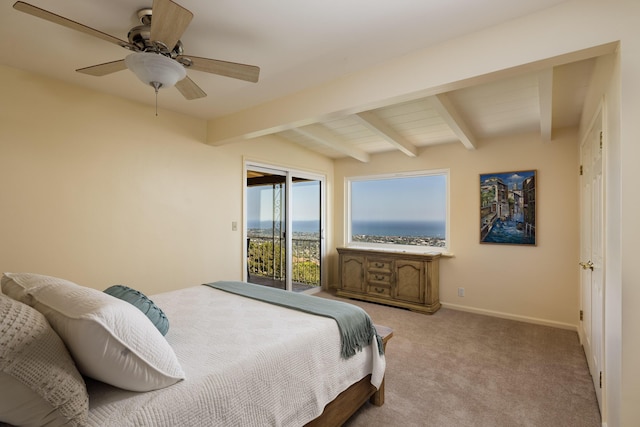 carpeted bedroom with ceiling fan, access to outside, and vaulted ceiling with beams