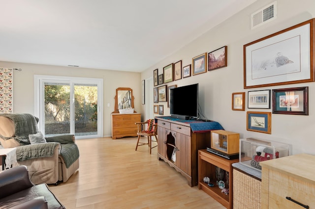 living room with light hardwood / wood-style floors