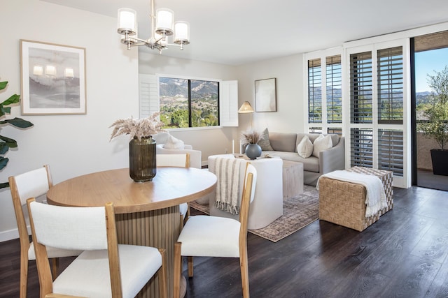 dining area featuring an inviting chandelier and dark hardwood / wood-style floors