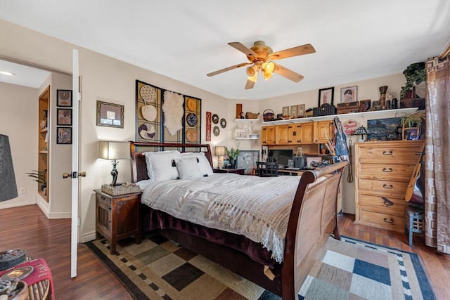 bedroom with ceiling fan and dark hardwood / wood-style floors