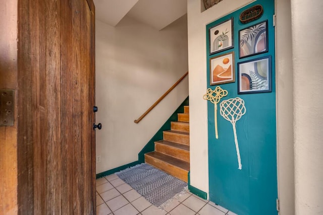 stairs with tile patterned floors