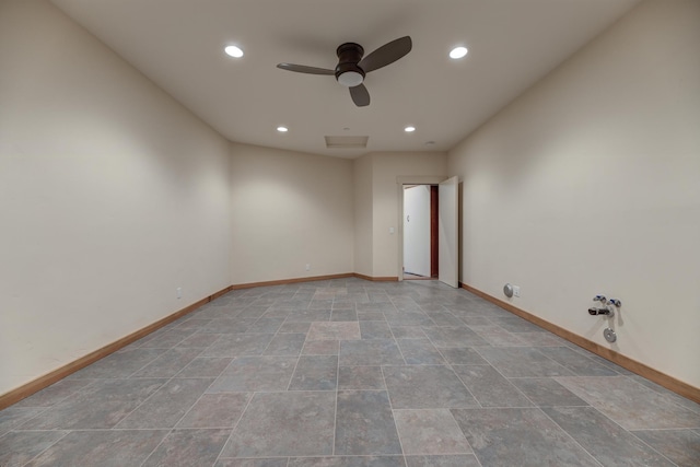 spare room featuring a ceiling fan, recessed lighting, stone finish flooring, and baseboards