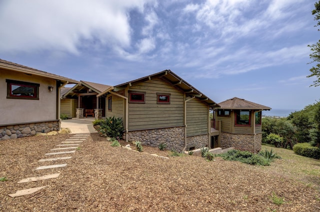 view of front of home featuring stone siding