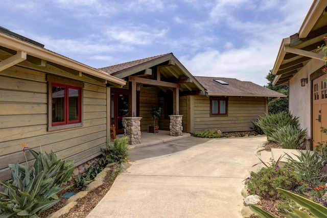 exterior space with a shingled roof