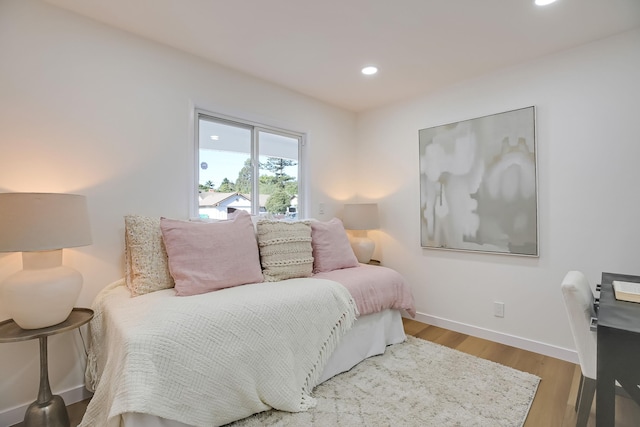 bedroom with light hardwood / wood-style flooring