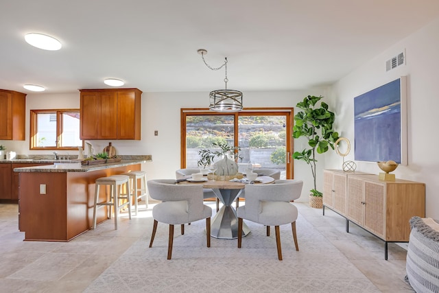 dining room featuring a chandelier