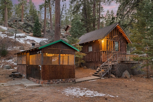 view of front of home featuring a wooden deck