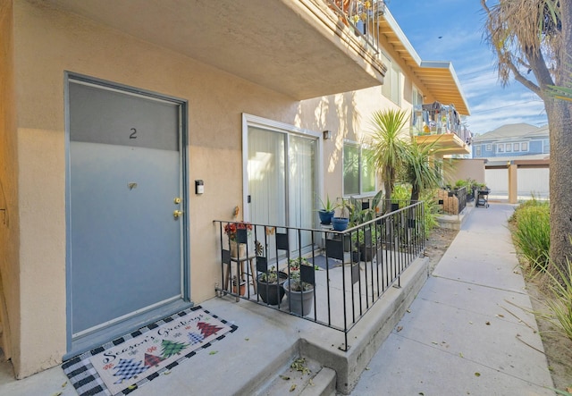 property entrance with a balcony