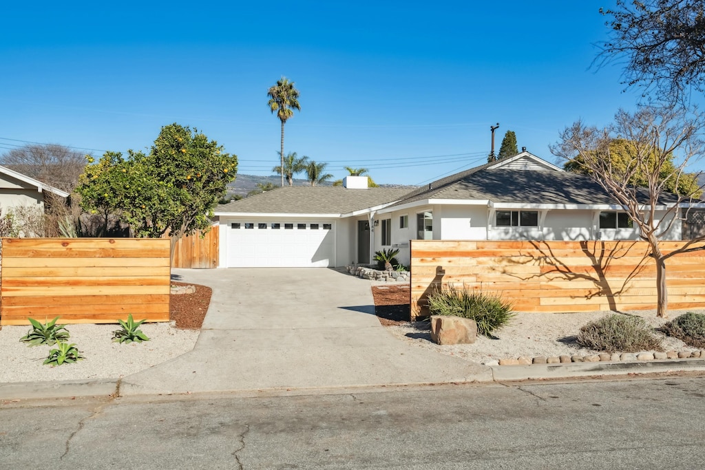 single story home with a garage