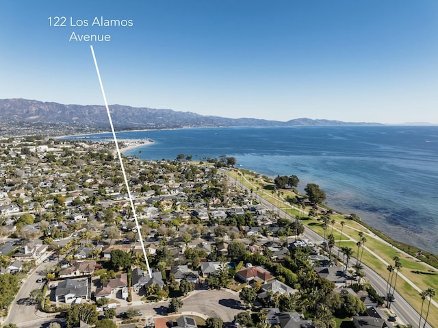 drone / aerial view with a water and mountain view