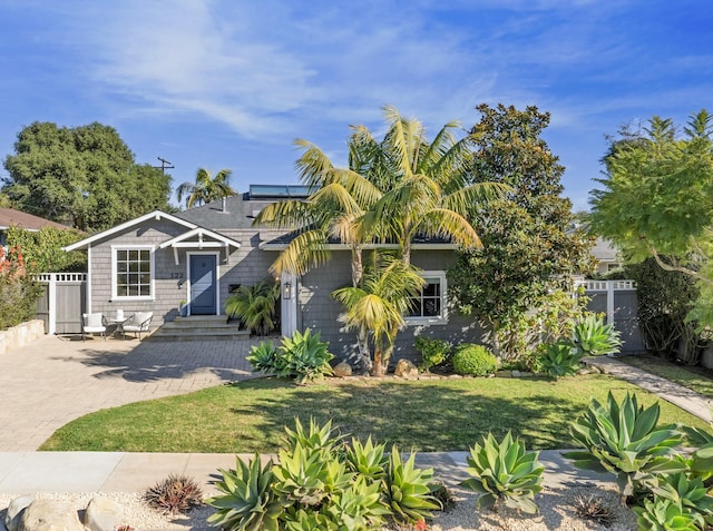 view of front of property with a front yard and a patio