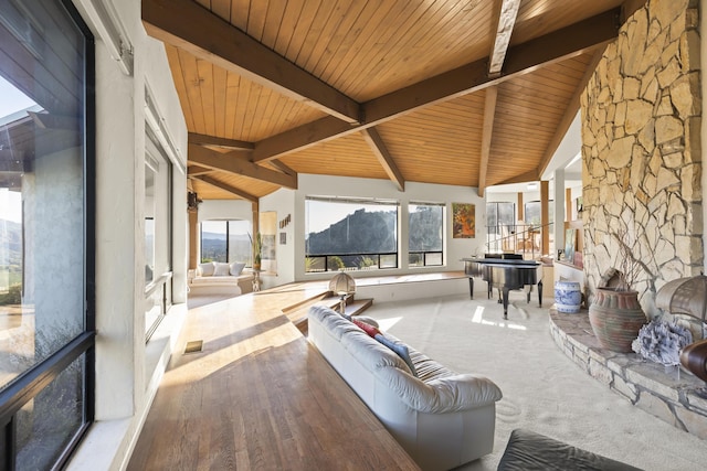 sunroom / solarium with vaulted ceiling with beams and wood ceiling