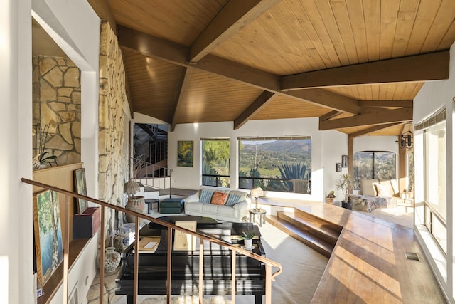 sunroom / solarium with lofted ceiling with beams and wooden ceiling