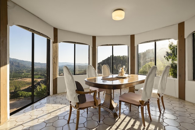 sunroom with a mountain view