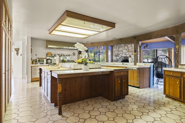 kitchen featuring a breakfast bar area and an island with sink