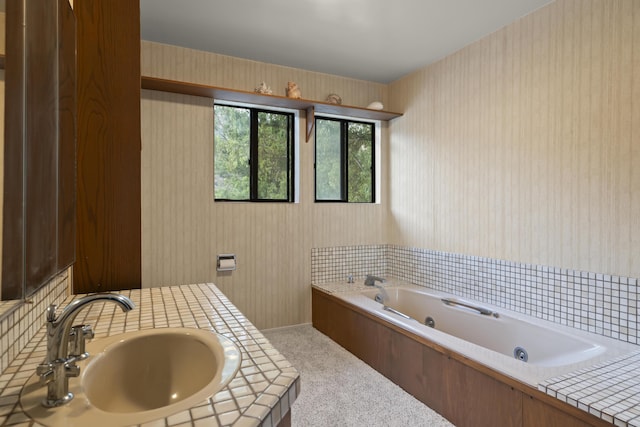 bathroom featuring a bath and sink