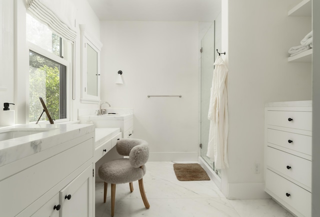 bathroom featuring vanity and a shower with door