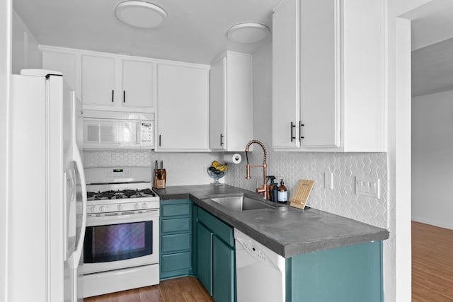 kitchen with white cabinetry, sink, white appliances, and dark hardwood / wood-style flooring