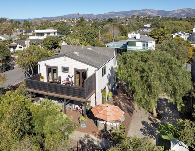 birds eye view of property featuring a mountain view