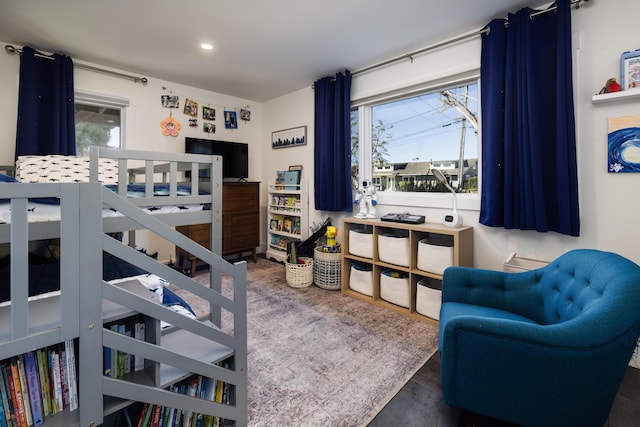 bedroom with recessed lighting and multiple windows