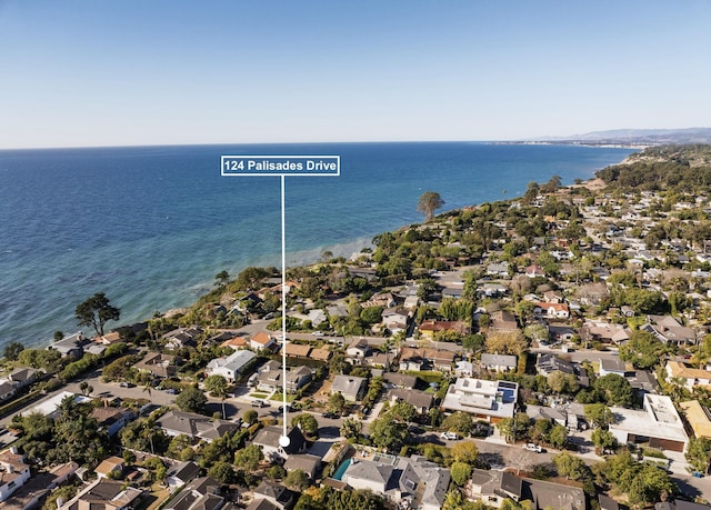 drone / aerial view with a residential view and a water view