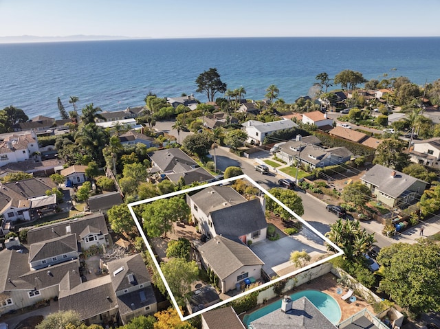 birds eye view of property featuring a residential view and a water view