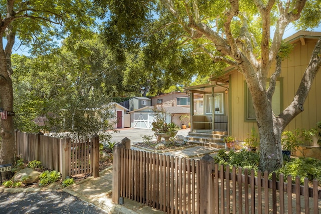 view of front of home featuring an outbuilding and a garage