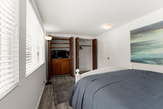 bedroom featuring dark hardwood / wood-style floors