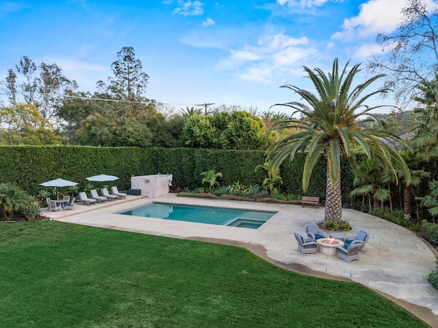 view of swimming pool with an outdoor fire pit, a yard, and a patio