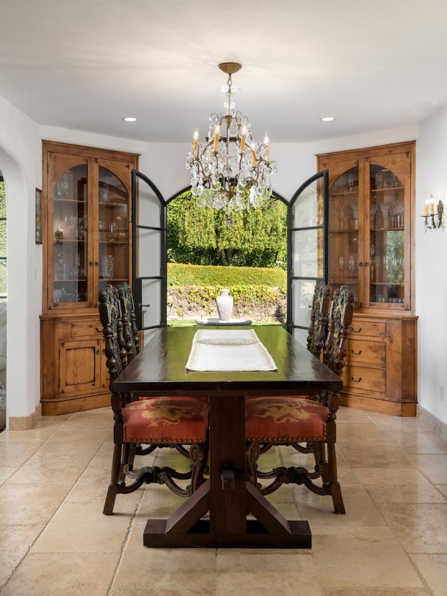 dining space featuring a notable chandelier and a wealth of natural light