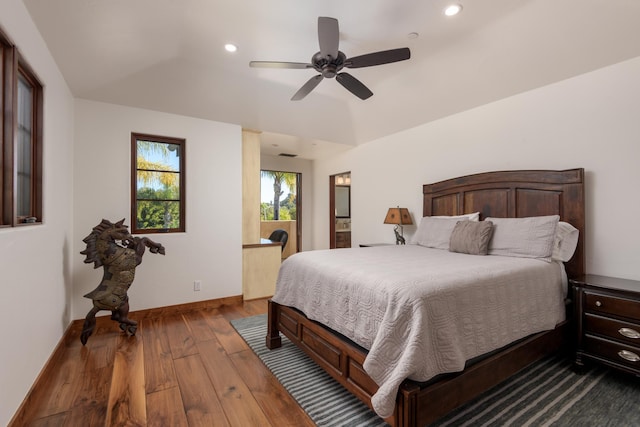 bedroom featuring lofted ceiling, hardwood / wood-style floors, and ceiling fan