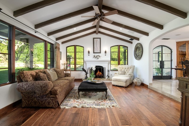 sunroom featuring vaulted ceiling with beams