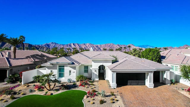 view of front of house featuring a mountain view and a garage