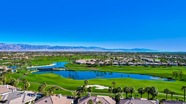 birds eye view of property with a water and mountain view