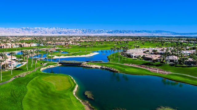 drone / aerial view with a water and mountain view