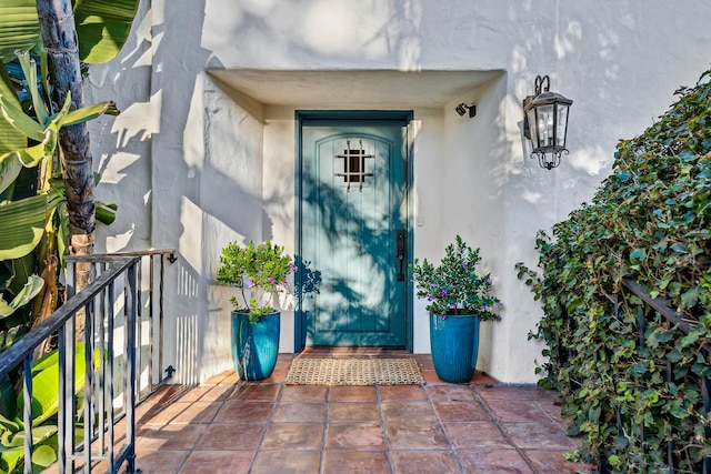 doorway to property with stucco siding