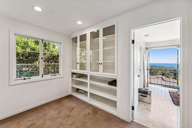 interior space with a wealth of natural light, visible vents, baseboards, and recessed lighting