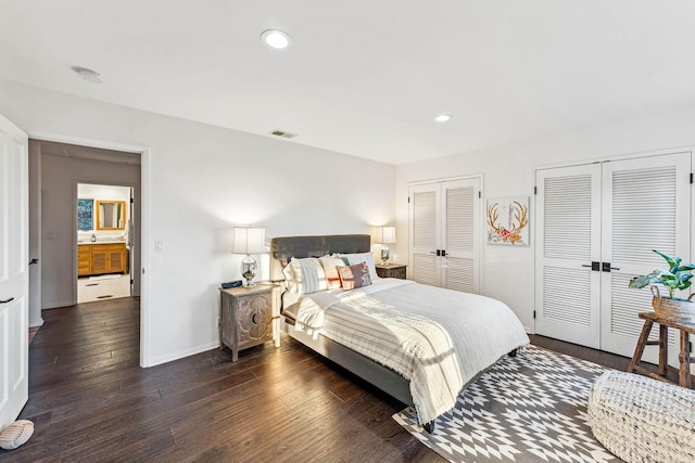 bedroom featuring two closets, hardwood / wood-style floors, recessed lighting, french doors, and baseboards