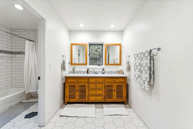 bathroom featuring a sink, baseboards, toilet, and double vanity