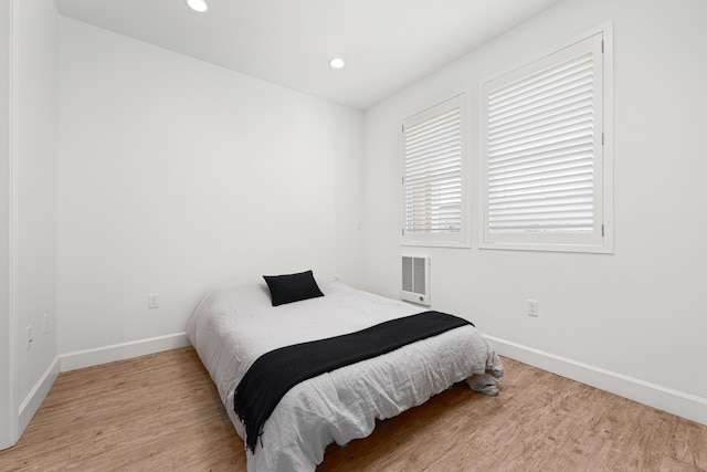 bedroom with light wood-type flooring