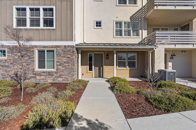 entrance to property featuring central AC unit