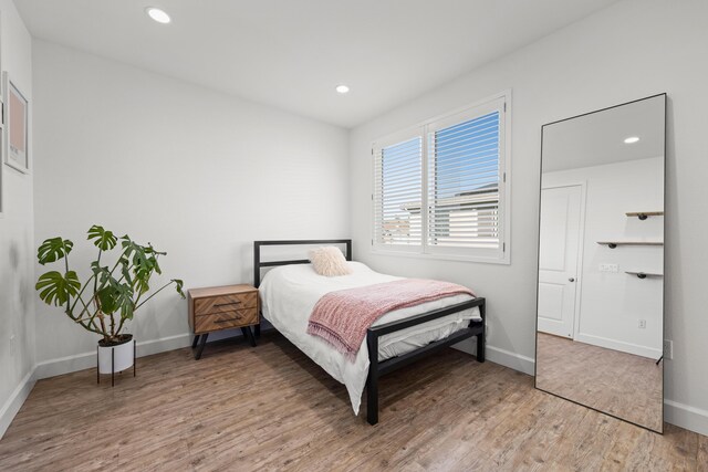 bedroom featuring hardwood / wood-style floors